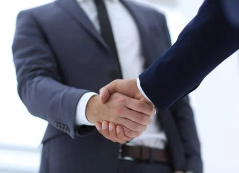 Close up of two young male business partner shake hand Stock Photos