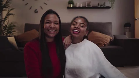 Close-up of two young smiling African American women blogger making a streaming Stock Footage 256041057