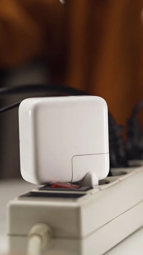 Close Up of Type-C Cable Plugging into Charger in Multiple Socket Power Strip Stock Footage 309668157
