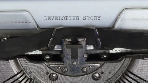Close up typewriter typing text DEVELOPING STORY. Typewriting on old typewriter Video stock 171026307