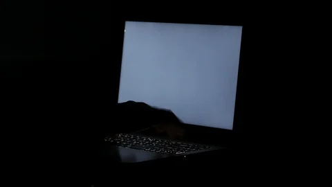 Close up  typing keyboard laptop computer black screen on the table in the da Stock Footage 89381092