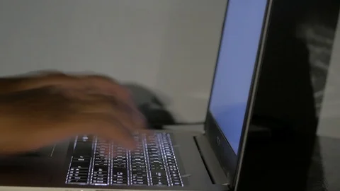 Close up  typing keyboard laptop computer black screen on the table in the da Stock Footage 89381153
