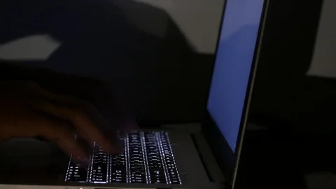 Close up  typing keyboard laptop computer black screen on the table in the da Stock Footage 89381302