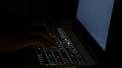 Close up  typing keyboard laptop computer black screen on the table in the da Stock Footage 89381464