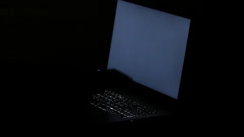 Close up  typing keyboard laptop computer black screen on the table in the da Stock Footage 89382232