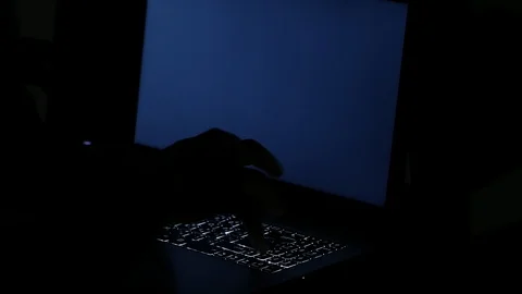 Close up  typing keyboard laptop computer black screen on the table in the da Stock Footage 89382324