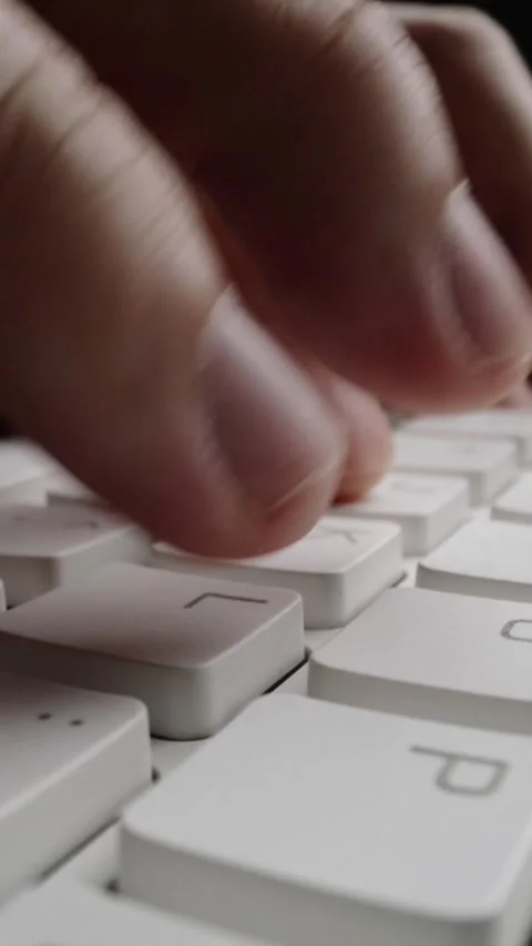 Close-up typing on keyboard with man fingers. Macro soft focus dolly shot. Stock Footage 284979744