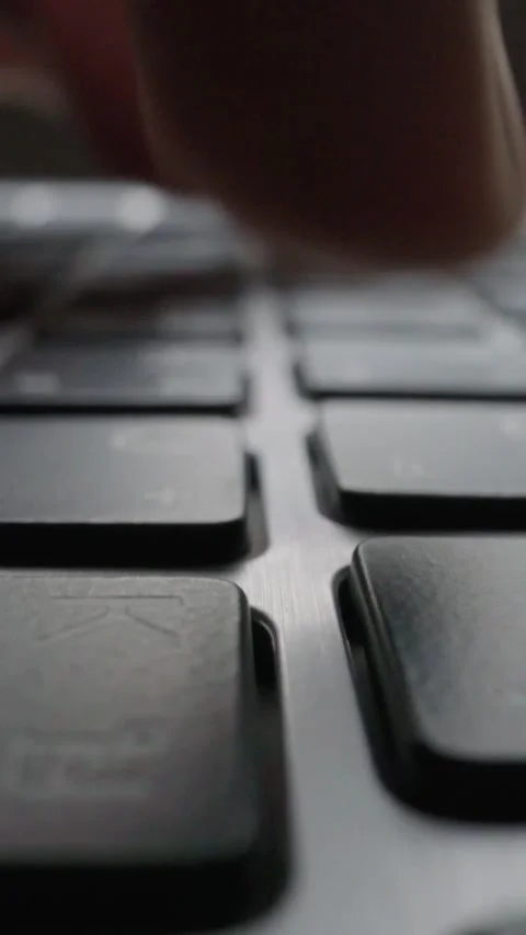 Close-up typing on keyboard with man fingers. Macro soft focus dolly shot. Stock Footage 287015195