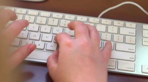 Close Up Typing Keyboard Over the Shoulder Video stock 43259407
