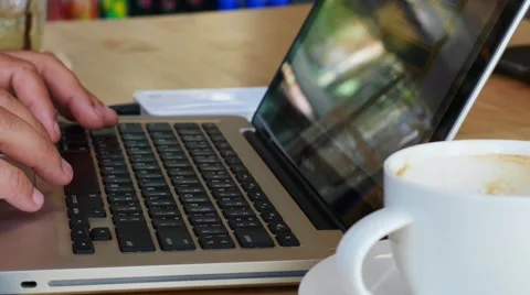 Close-up of  typing on a laptop keyboard Stockbeeldmateriaal 64100596