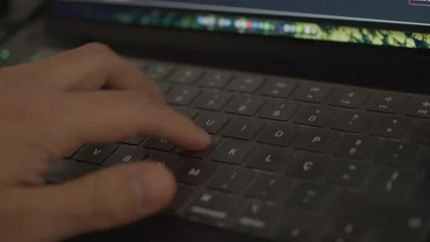 Close up typing on laptop keyboard at night Stock Footage 330992618