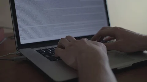 Close up typing on a laptop from a left angle shot. Stock Footage 87080160