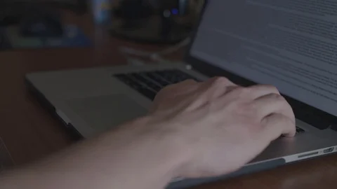 Close up typing on a laptop from a right angle shot. Stock Footage 88708953