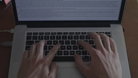 Close up typing on a laptop from a top down shot. Stock Footage 87080046