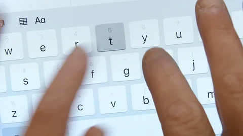 Close up of typing on a mobile tablet Stock Footage 92619898