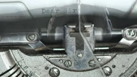 Close up typing text DEAR SIR I AM . Typewriting on a vintage typewriter Stock Footage 171022402