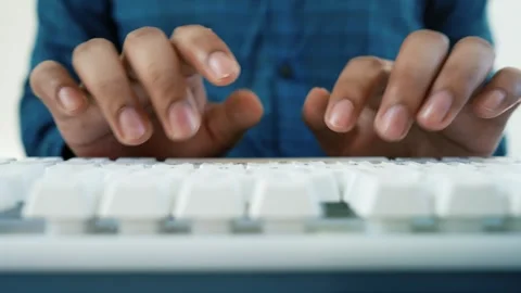 Close-Up of Typing on White Keyboard Stock Footage 320725974