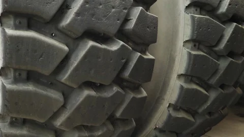 Close-up of the tyre tread of the world's largest mining truck. Big truck wheels Vidéo 243068490