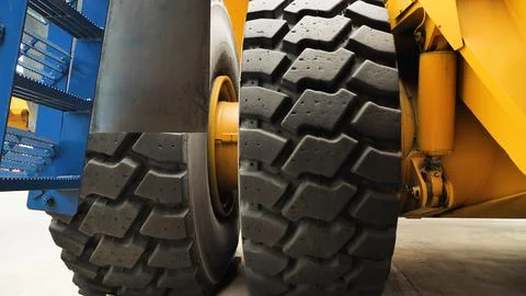 Close-up of tyre tread of the world's largest quarry truck. Huge truck whee.. Stock Photos