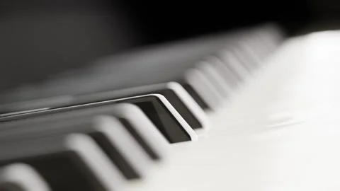 Close-up U-turn arc shot of piano keyboard. Background for classical musical Stock Footage 260937090