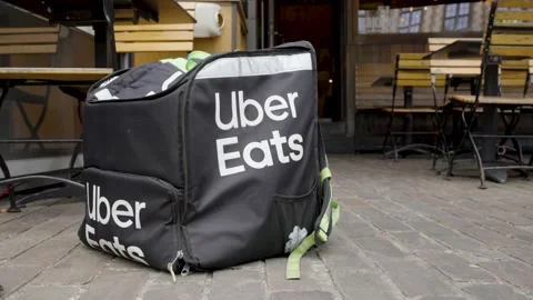 Close up of Uber Eats Thermal bag in front of restaurant Stock Footage 197115961