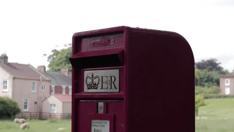 Close-up of a UK postbox in a small village, handheld Video stock 91617765