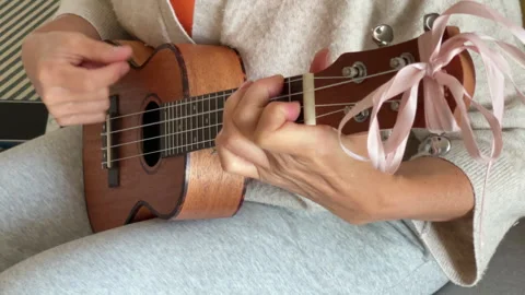 Close up Ukulele or uke string instrument video popular on Hawaii islands. Woman Vidéo 323849369
