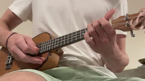 Close up Ukulele or uke string instrument video popular on Hawaii islands. Teena 動画素材 323952394