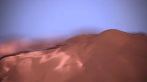 Close-up ultra-slow motion bronze-toned water flowing toward camera Stock Footage 59527356