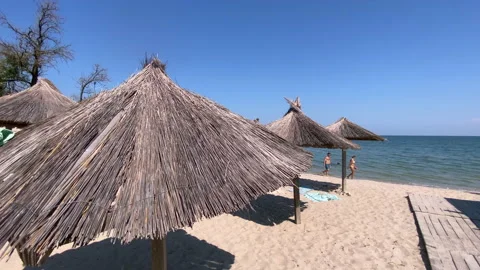 Close Up. Umbrellas on the empty closed beach during  coronavirus pandemic Video stock 159272702