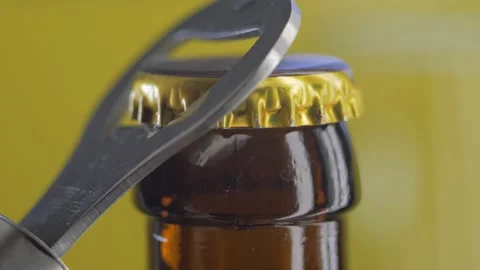 Close-up of unable to open the lid on a glass beer bottle. Stop drinking concept Stock Footage 144627140