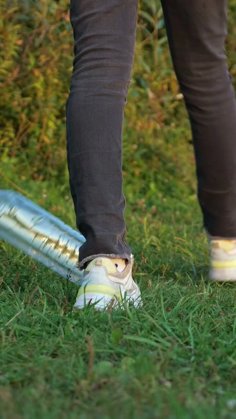 Close up of an uncivilized persons legs walking on a lawn and carelessly Video stock 341428812