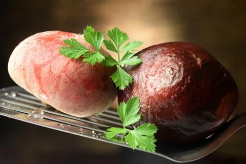Close up on uncooked and precooked beetroot Stock Photos