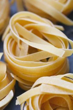 Close-up of uncooked nests of spaghetti Stock Photos