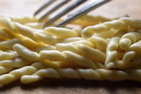 Close up on uncooked strozzapreti. Stock Photos