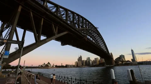 Close under massive steel arch of Sydney Harbour bridge at sunset time lapse. Stock Footage 134687975