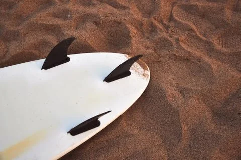Close Up Of Underside Of Surfboard Lying On Sand Foto stock