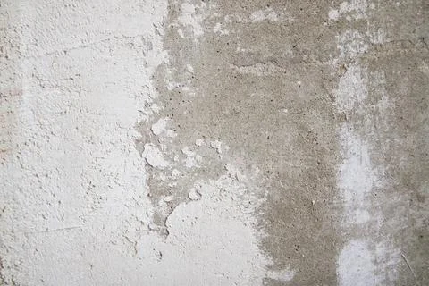Close-up of uneven wall texture with spackle stains and plaster layers. Minim 스톡 사진
