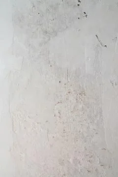 Close-up of unfinished plaster coating on wall prepared for renovation. Rep.. Stock Photos