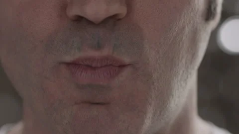 Close-up of unidentified contented middle-aged man eating meat Stock Footage 143090677