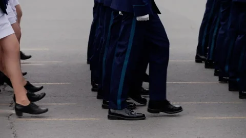 Close-up of uniformed personnel marching in precise formation during a Video stock 317563782