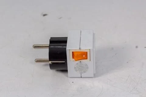 Close up of universal electric socket plug adapters, isolated on white backgr Stock Photos