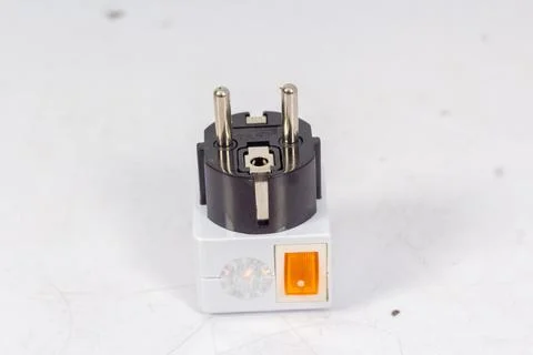 Close up of universal electric socket plug adapters, isolated on white backgr Stock Photos