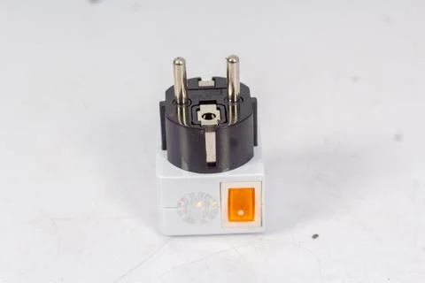 Close up of universal electric socket plug adapters, isolated on white backgr Foto stock