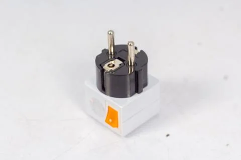 Close up of universal electric socket plug adapters, isolated on white backgr Stock Photos