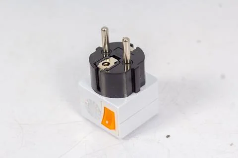 Close up of universal electric socket plug adapters, isolated on white backgr Stock Photos