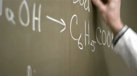 Close up of a university professor writing chemistry equations on the blackboard Stock Footage
