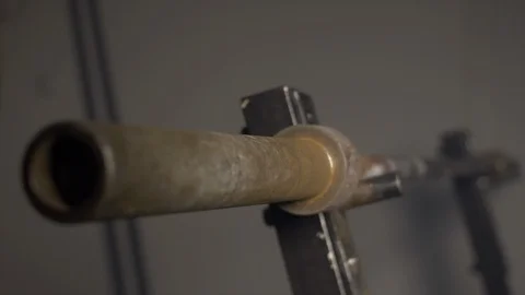 Close Up Of Unloaded Barbell On Squat Rack In Industrial Gym Room Under Ground  Stock Footage 123063056