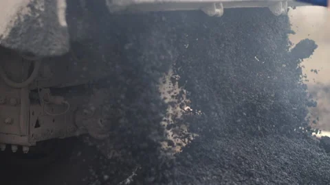 Close up of unloading asphalt mix. Road repair. Road construction works. Stock-Footage 153766085