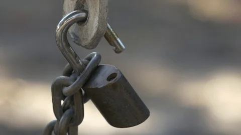 Close-Up of Unlocked Padlock on Gate, 4K Stock Footage 72879254